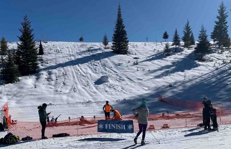 Flathead County 4-H youth participate in a winter biathlon ski and air rifle shoot relay race.